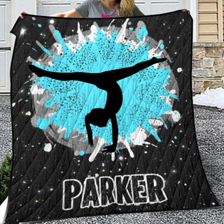 a woman holding a blanket with a picture of a person doing a handstand