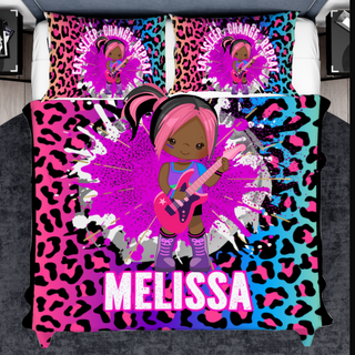 a bed with a pink and blue leopard print and a girl with a guitar