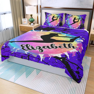 a bed with a colorful comforter and pillows