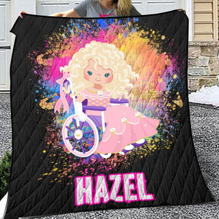 a woman holding a black blanket with a picture of a blonde girl on it