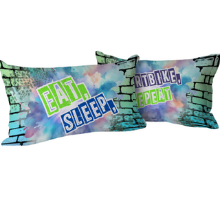 two pillows with the words eat sleep repeat on them