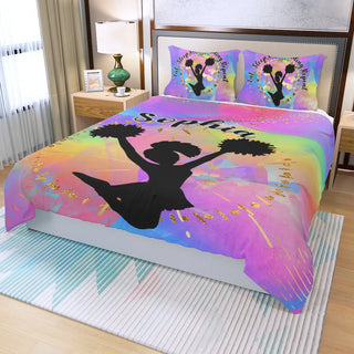 a bed with a colorful bed cover with a silhouette of a girl dancing