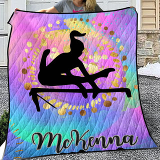 a woman holding up a colorful blanket with a picture of a man on it