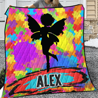 a woman holding a colorful blanket with a picture of a fairy on it