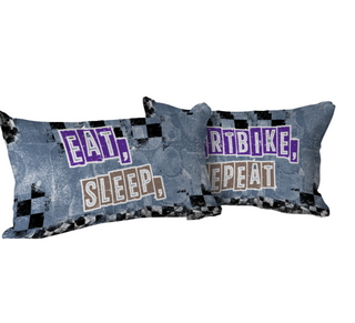 a pair of pillows that say eat, ride, sleep, repeat