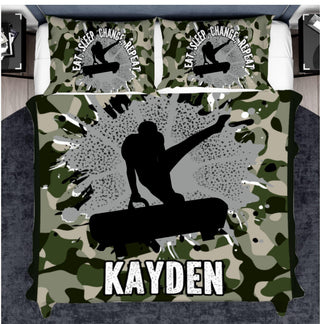 a bed with a camo comforter and a skateboarder on it