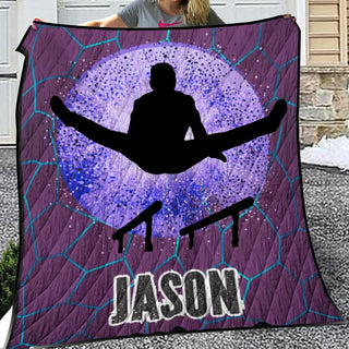 a woman holding up a purple and blue snowboarder quilt