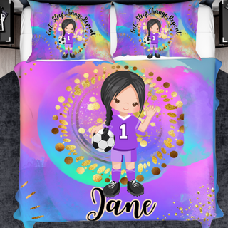 a girl with a soccer ball and name on a bed