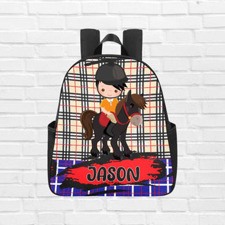 a backpack with a picture of a boy riding a horse