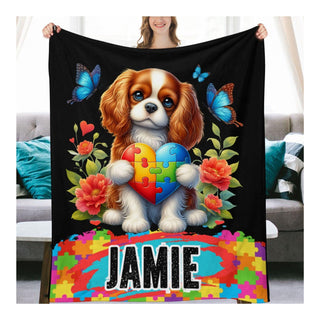 a woman holding a blanket with a dog on it