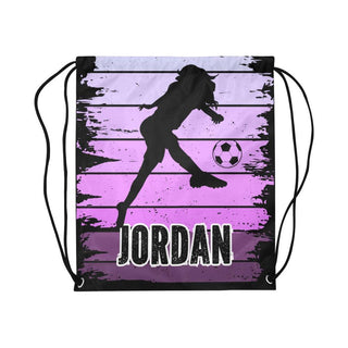 a drawsack bag with a girl kicking a soccer ball