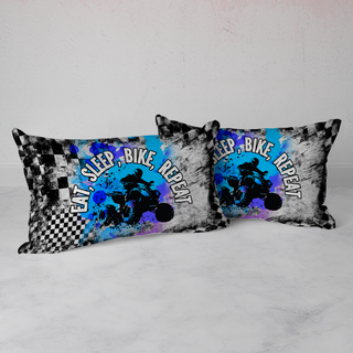 two black and white pillows on a white surface