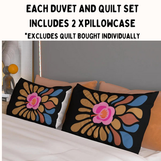 a bed with two pillows on top of it