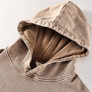 a close up of a hoodie on a white surface