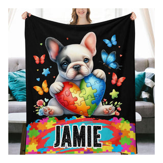 a woman holding a black blanket with a picture of a dog holding a puzzle heart