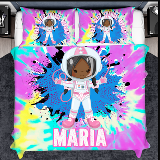 a bed with a picture of a girl in a space suit on it