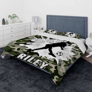 a bed room with a camo comforter and a bed