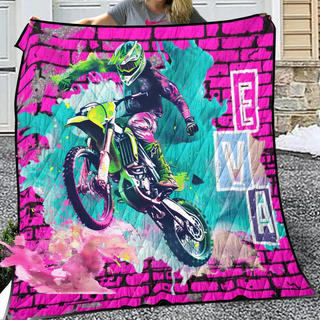 a woman holding a pink and green motorcycle blanket