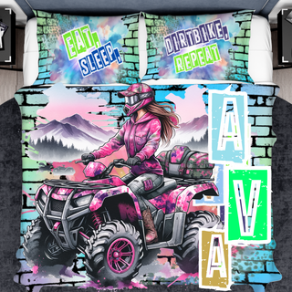 a bed with a picture of a girl riding an atv