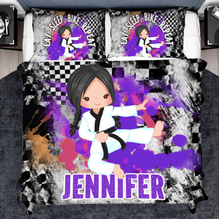 a bed with a purple and black bed cover