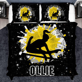 a bed with a black and yellow cover with a picture of a snowboarder