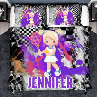 a bed with a picture of a girl holding a tennis racket