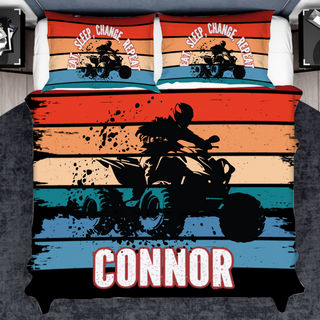 a bed with a motorcycle on it and a comforter