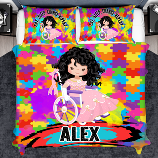 a bed with a colorful comforter with a picture of a girl on it