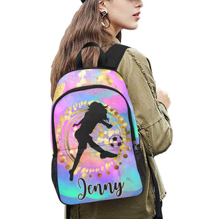 a woman wearing a backpack with the name jenny on it