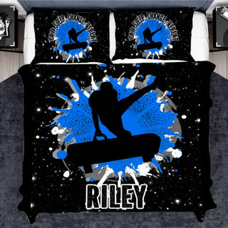 a bed with a black and blue cover with a picture of a snowboarder