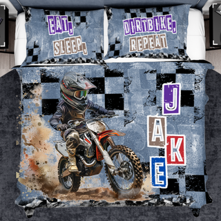 a bed with a dirt bike theme on it