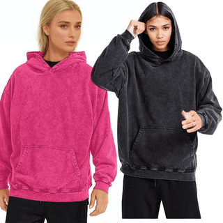 a woman in a black and pink hoodie and a woman in a black and