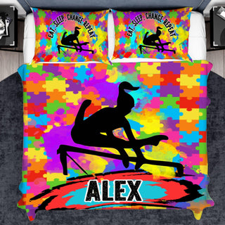 a bed with a colorful bed cover with a picture of a man on a surf