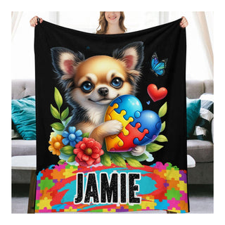 a woman holding a blanket with a dog on it