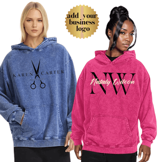 two women wearing sweatshirts with the same name on them