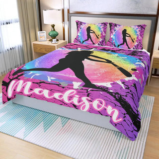 a bed with a colorful comforter and pillows