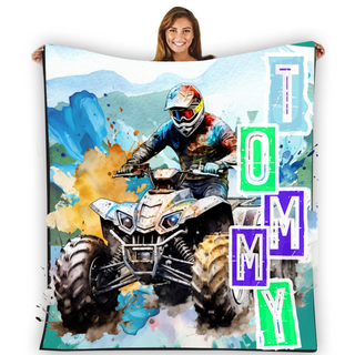 a woman holding a blanket with a picture of a person on a quad