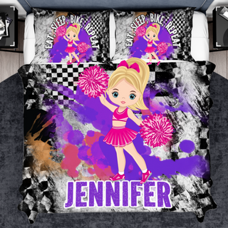 a bed with a picture of a girl with a cheerleader on it