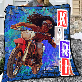 a woman holding a blanket with a picture of a woman on a motorcycle