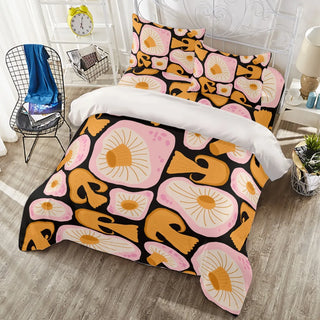 a bed with a pink and yellow flower pattern on it