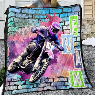 a person on a dirt bike on a blanket