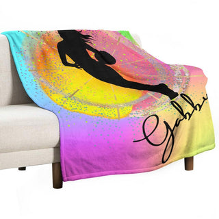 a couch with a blanket on it with a picture of a woman on it