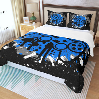 a bed covered in a blue and black comforter