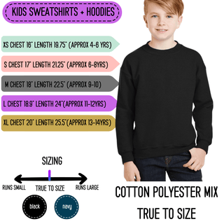 a young boy wearing a black sweatshirt with the words cotton polyster mix on it