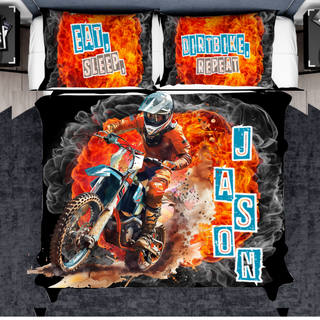 a bed with a picture of a motorcyclist on it