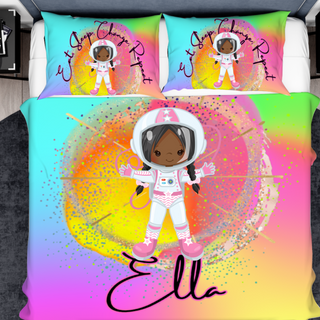 a bed with two pillows and a picture of an astronaut