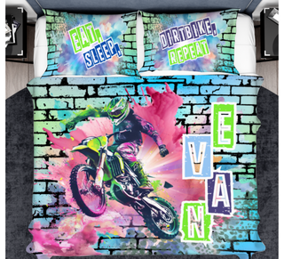 a bed cover with a picture of a motorcyclist on it