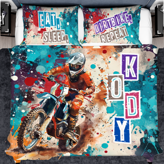 a bed with a picture of a dirt bike rider on it