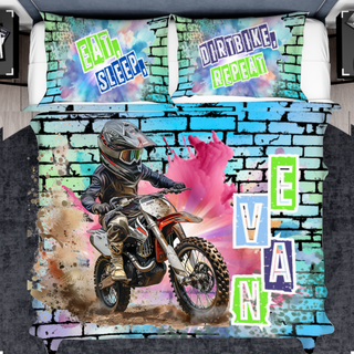 a bed with a picture of a dirt bike rider on it