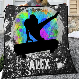 a woman holding up a blanket with a picture of a skateboarder on it